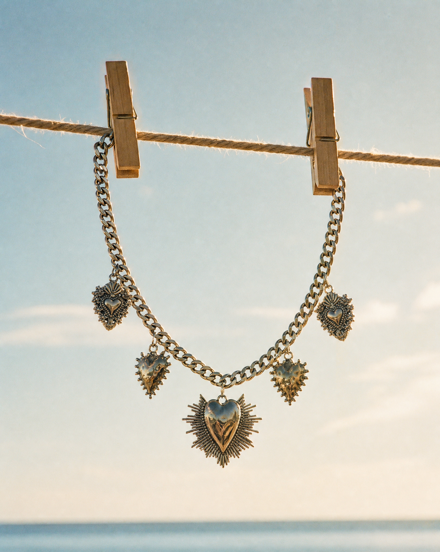 Collier chaîne gourmette multi-breloques Cœur sacré